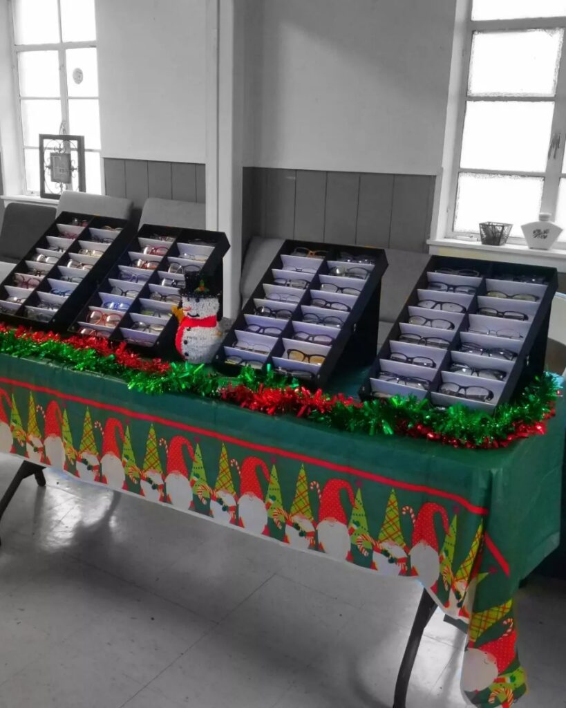 A table with many boxes of cards on it